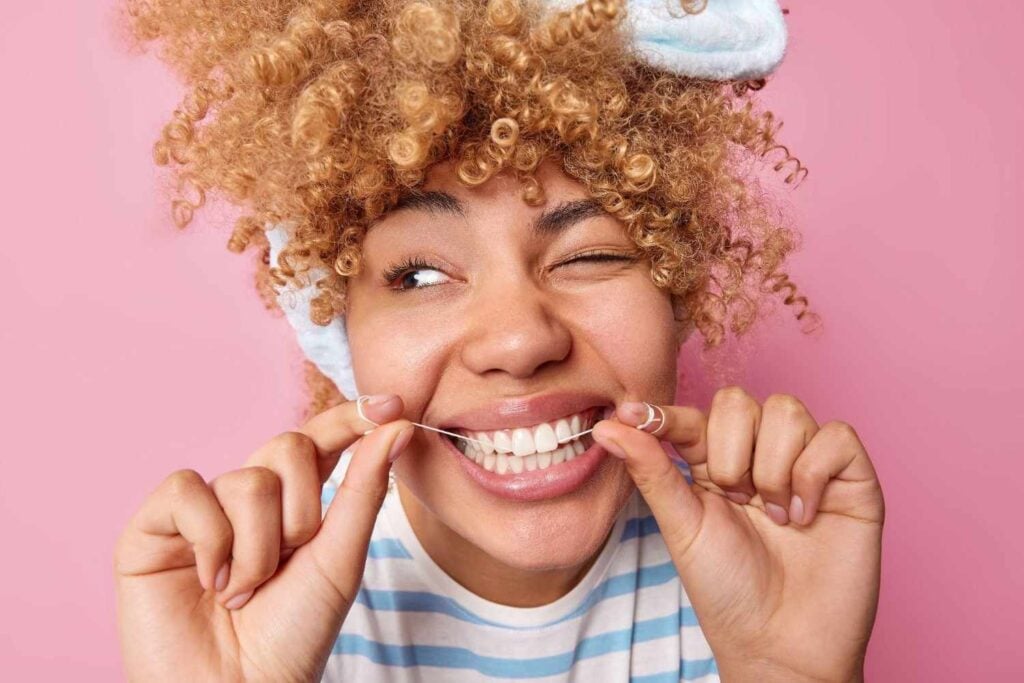 Flossing with braces. Best dental care practices for optimal health.