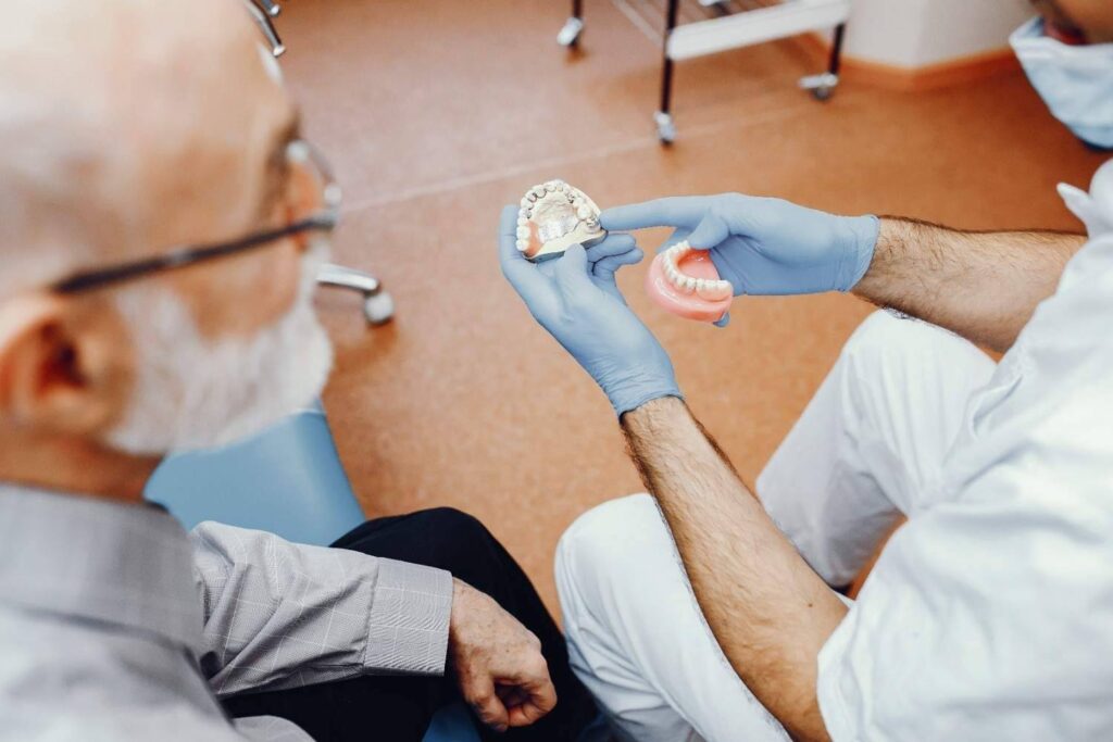 Patient with missing teeth considering dental implants in Albania as a better alternative for dentures.