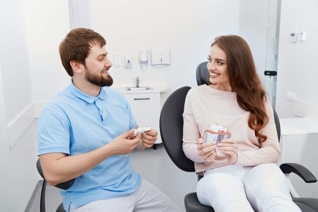 Satisfied patient talking to their dentist about the benefits of dental tourism in Albania
