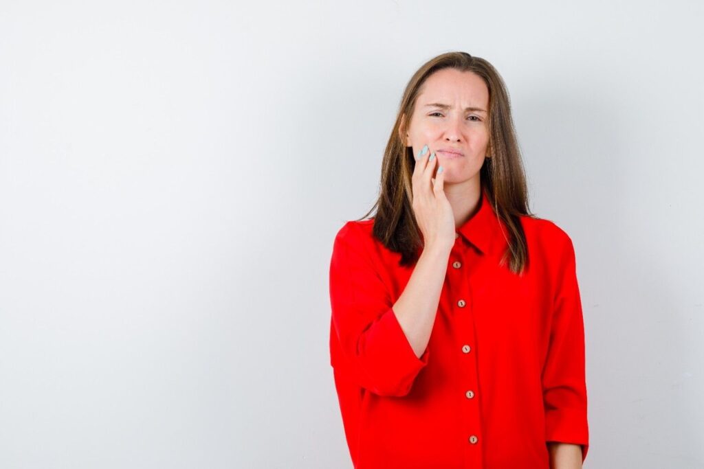 Woman considering getting dental implants in Albania as a great option for affordable tooth replacement