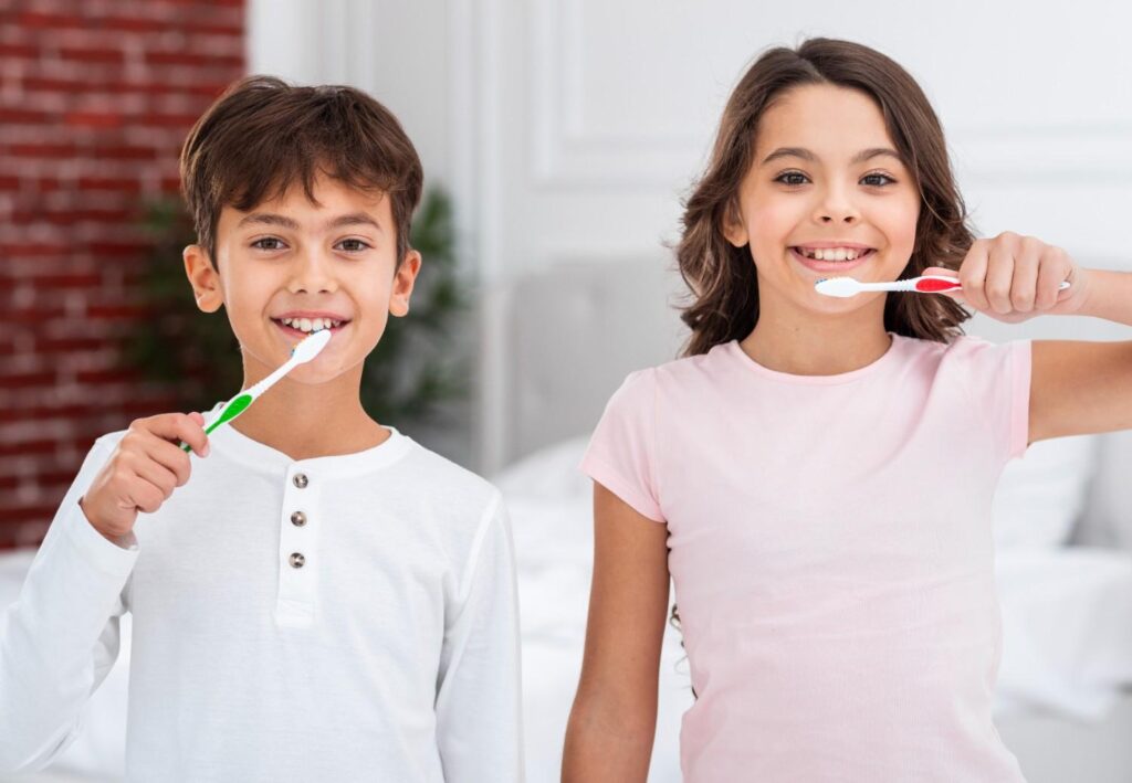 front view siblings brushing theets together 1